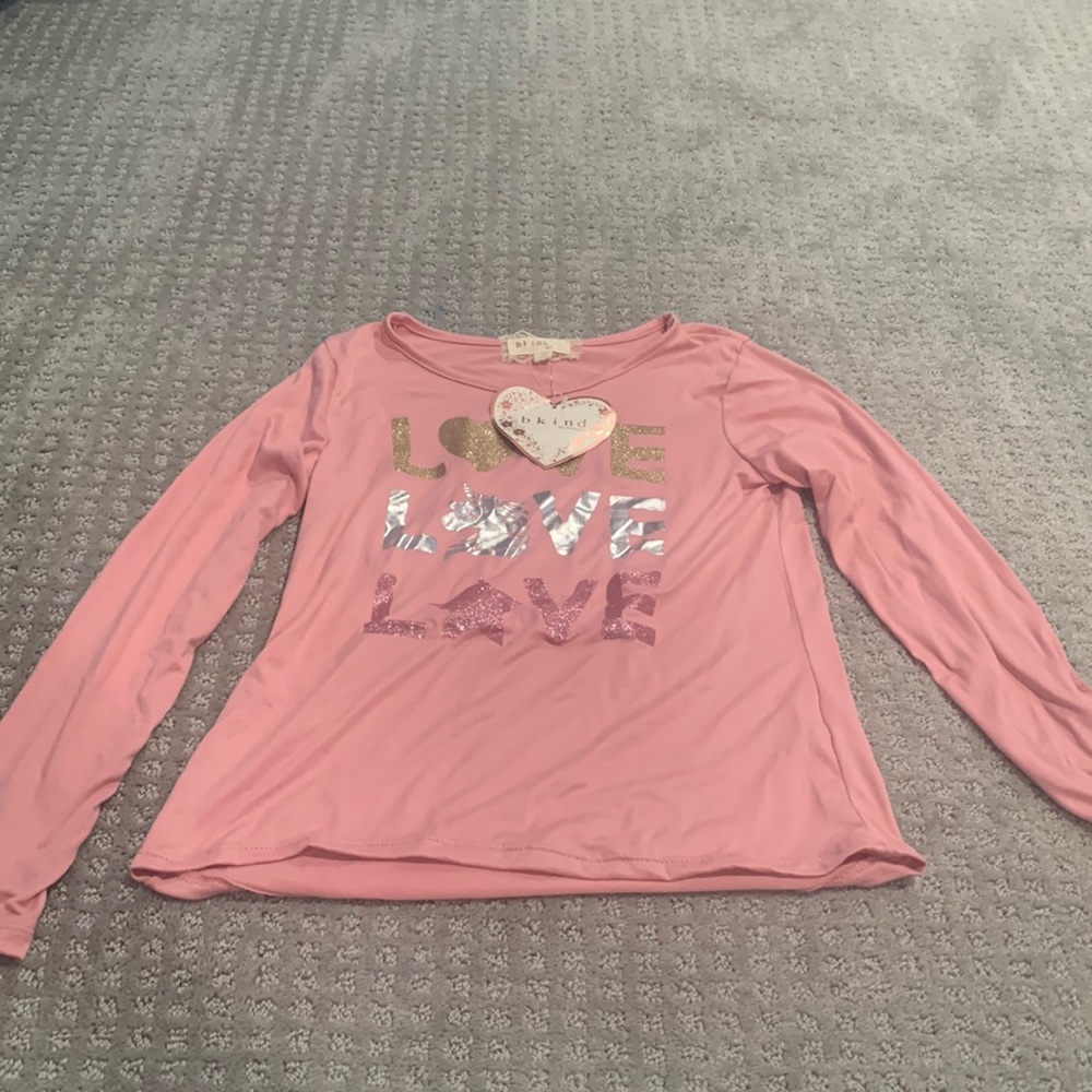 Brand new shirt with long sleeves girls size 10